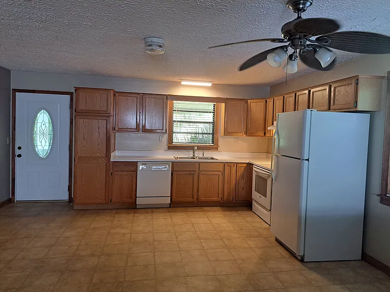 Updated kitchen with large open plan layout.
