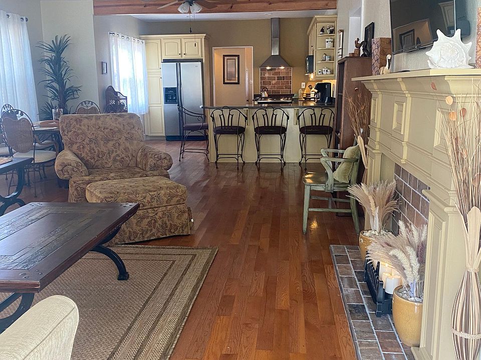 Open floor layout with living room, dining room and kitchen