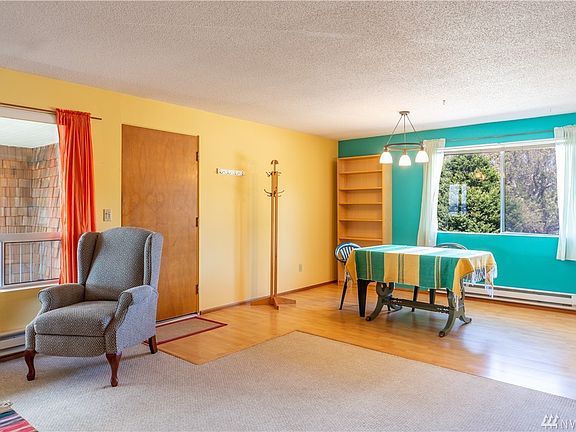 Living and Dining areas with open floor plan. Water view also from dining table.