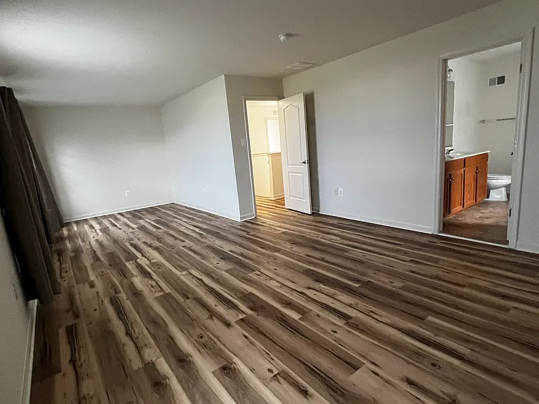 Master bedroom with view of bathroom