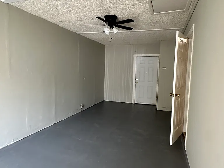Laundry hookup area (was a garage before it was enclosed)