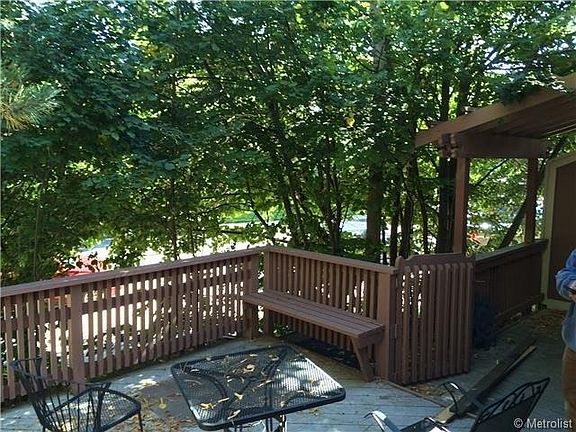 Back porch surrounded by mature trees