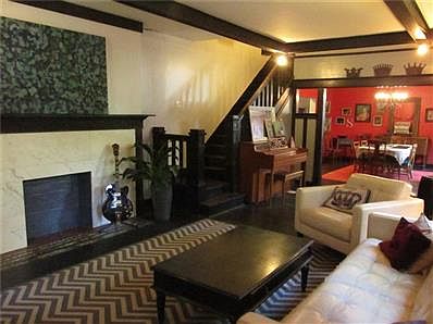 Living room with a better look at the fireplace and a view into the formal dining.