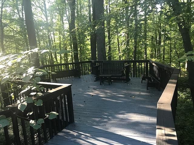 Treehouse at end of deck approximately 20 feet above ground.