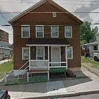 Welcome home! There is a new front door (not pictured), apartment for rent is on left (door now matches the right).
