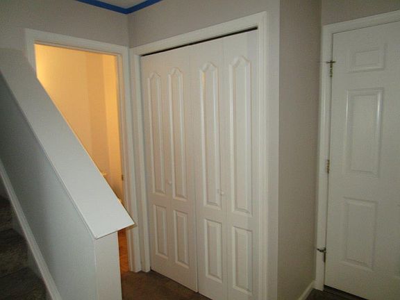 door to the garage on right and coat closet on left. Powder 