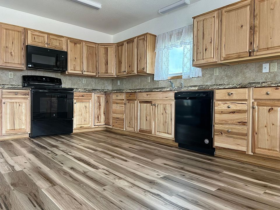 Recently updated kitchen with new floors, cupboards, backsplash and appliances!