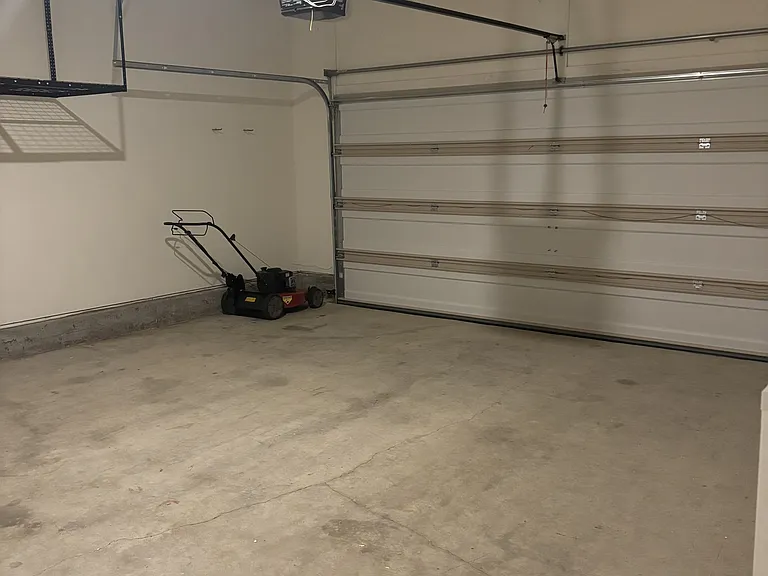 Lawnmower stays. Two car garage.