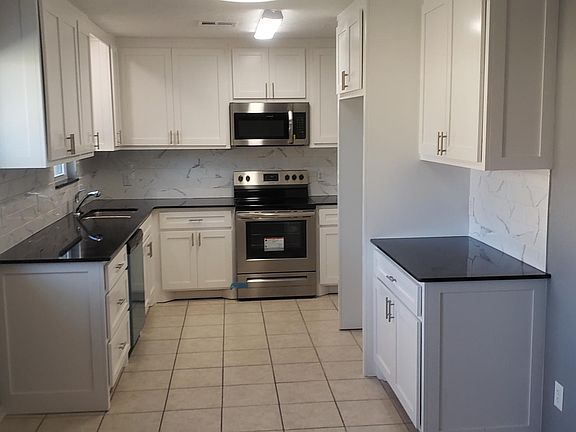 SPARKLING NEW KITCHEN - ALL STAINLESS STEEL APPLIANCES! AND DISPOSAL TOO.