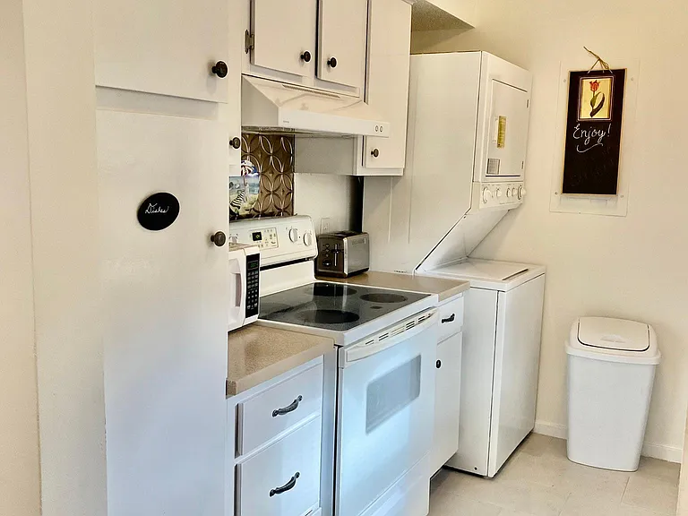 Kitchen with washer and dryer