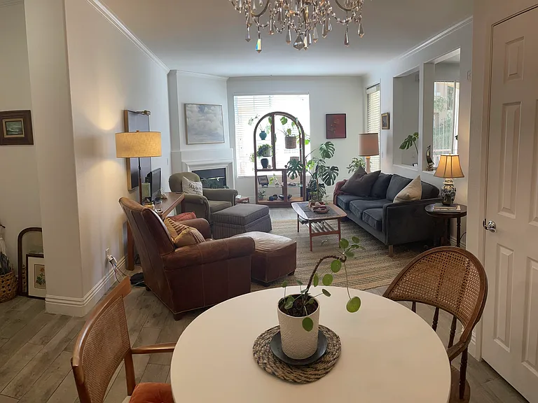 Standing in kitchen looking out to the main living area. (These mismatched chairs have been replaced as shown in previous image).