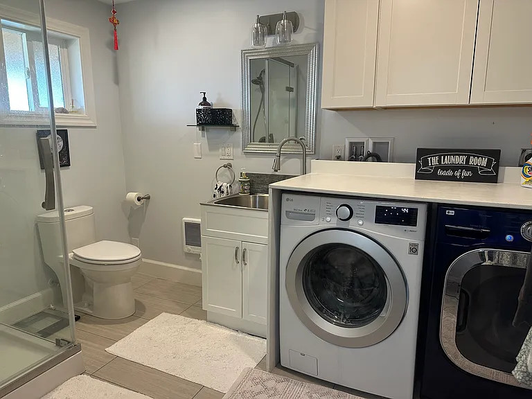 Basement bathroom and full size washer and dryer. Note the downstairs bathroom/bedroom is not for individual sublet, AirBnB, or other type of subcontract.