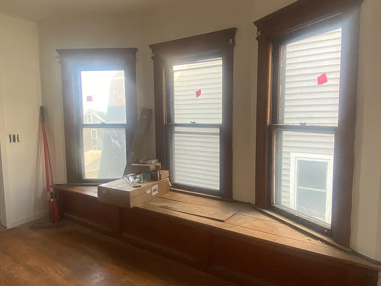 Beautiful bay windows with a custom bench with hidden storage.