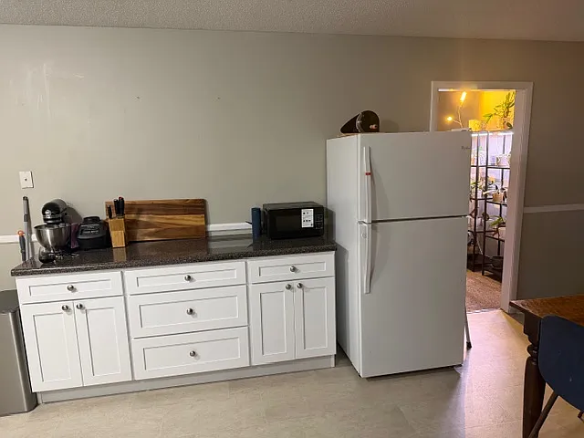 New buffet in eat in Kitchen with extra counter space and storage. Fridge was moved to this location by current tenants because they had their own, will be put back to the right of the range when they move out