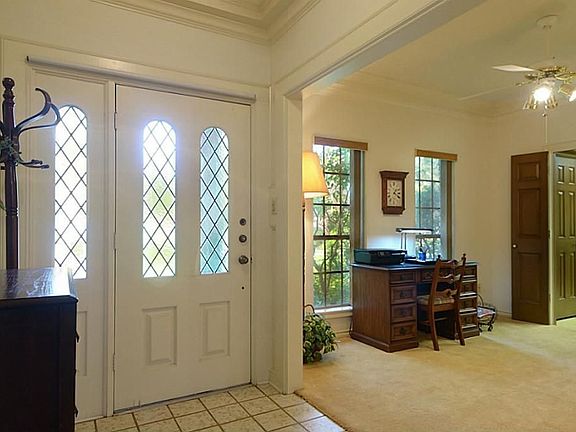 Guests enter thru this leaded glass door with matching side-lite that offers both illumination and p
