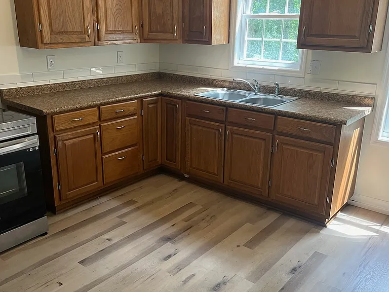 Kitchen with new flooring, paint and countertops