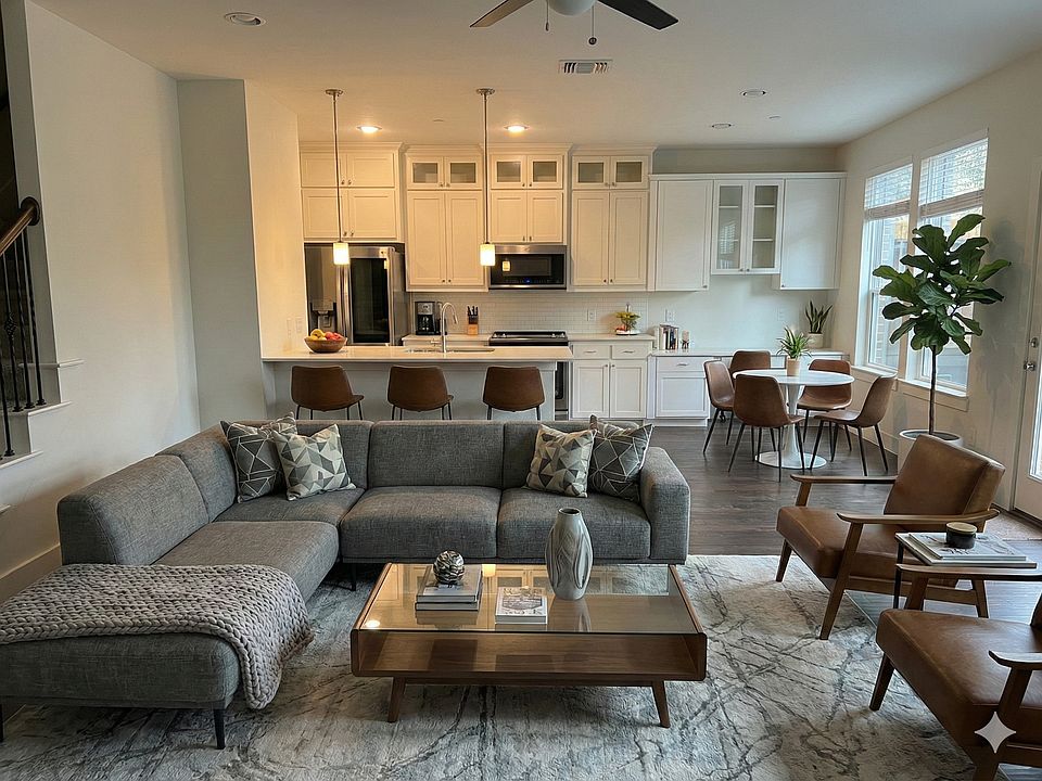 Downstairs living room angle 2. Staged with Gemini 3.0