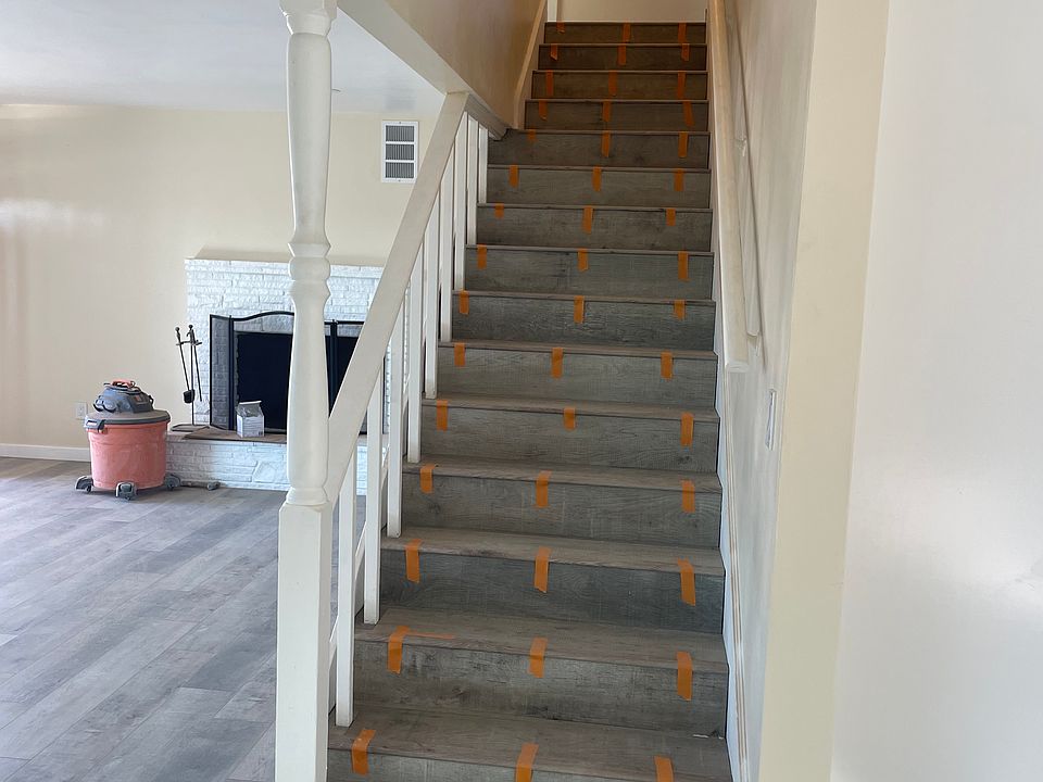 Stairway with All New 100% Waterproof PlanK Flooring Throughout Home