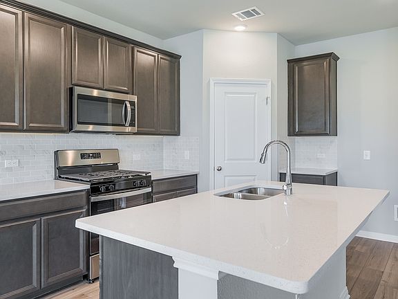 The Balanced design package features slate cabinets and white-tones quartz countertops.