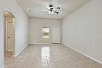 9 ft ceilings, Crown molding. Pass through with arch to kitchen