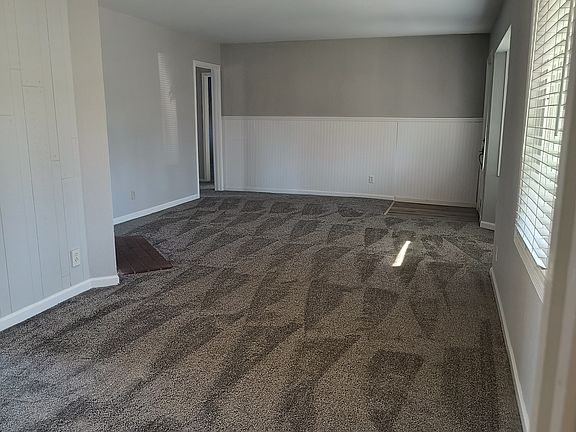 New flooring thru-out. Living room and dining area with fireplace