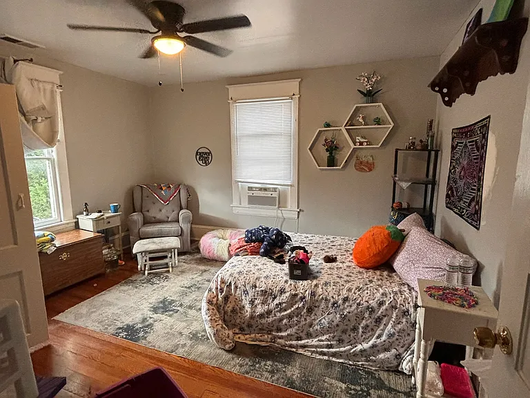 Large Main Bedroom w/ Two Large Windows for Natural Lighting. New Sherwin Williams Designer French Gray Paint. New 52" Ceiling Fan. Original Hardwood Floors.