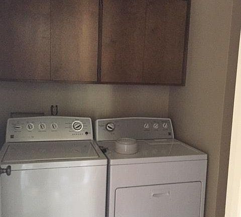 inside laundry with washer/dryer