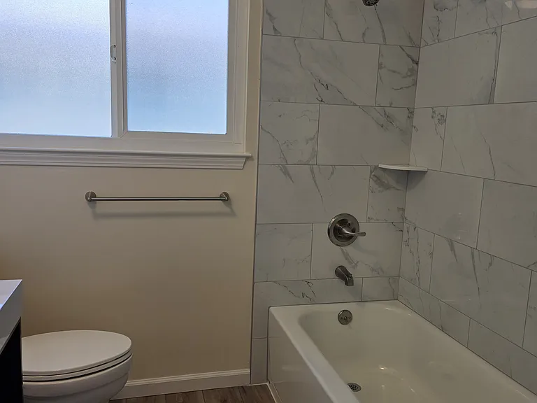 Bathtub with shower.