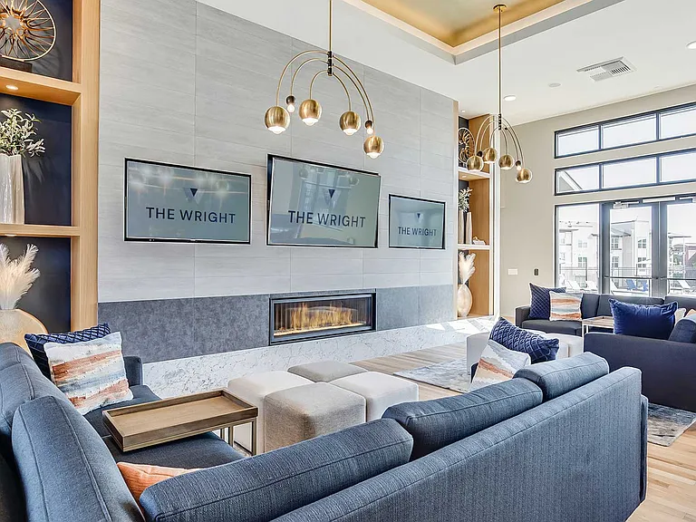 Modern resident lounge at The Wright featuring designer seating, contemporary finishes, and inviting gathering spaces designed for work, conversation, and everyday connection.