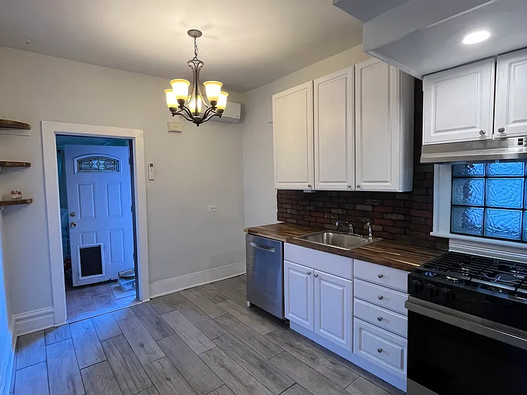 The refrigerator is now present in that empty corner