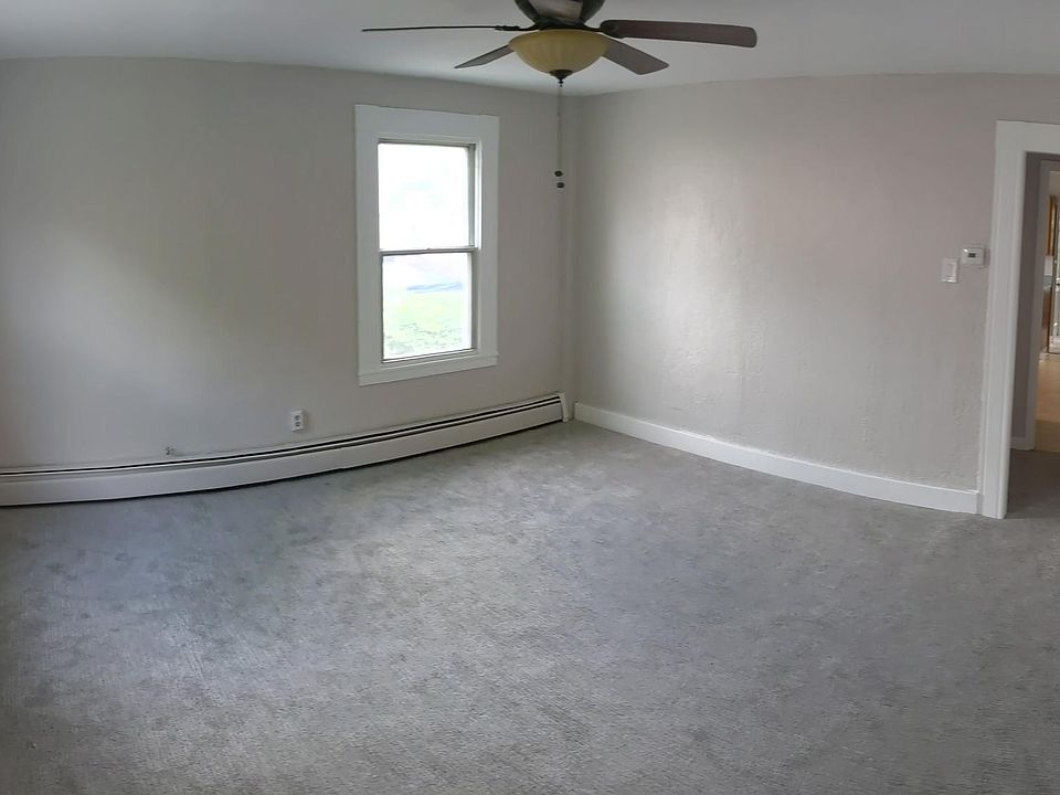 Spacious living room with recently updated carpet and painted walls