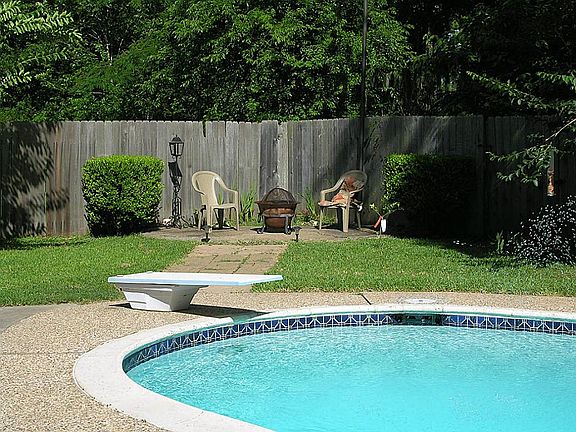 with a corner slab for a BBQ pit or fire pit.