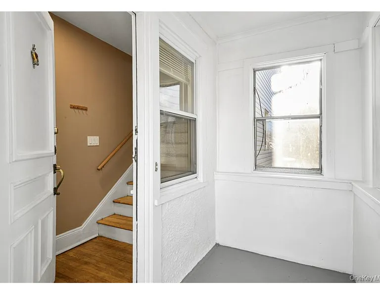Enclosed porch and interior door. Coat closet to the left as you go in.