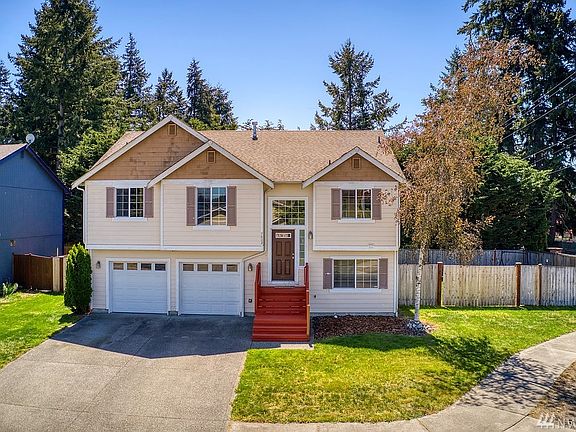 Extensive driveway accommodates multiple vehicles PLUS there is the always desirable RV parking to the side of the home!