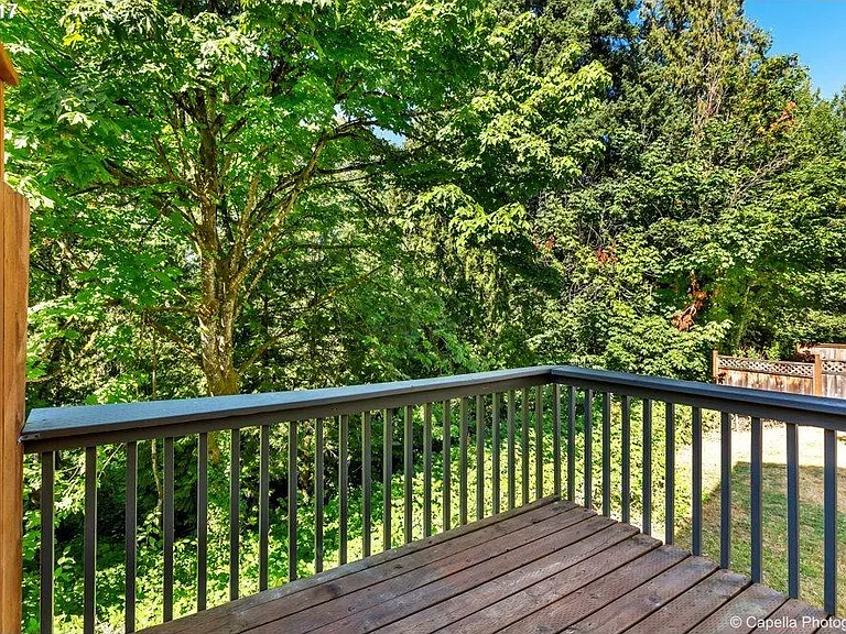 Large deck overlooking the creek offers a serene outdoor space to relax!
