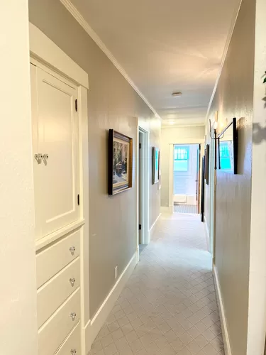 Hallway with built-in linen closet and access to bedrooms and bath - 1505 E Glen Ave #1
