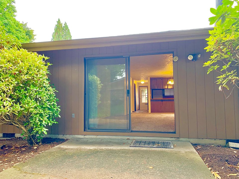 Big rear concrete patio w/faucet and privacy fencing. Established landscaping, large shade trees in rear add privacy and keeps patio cool. Patio door is oversized at 8 feet wide!