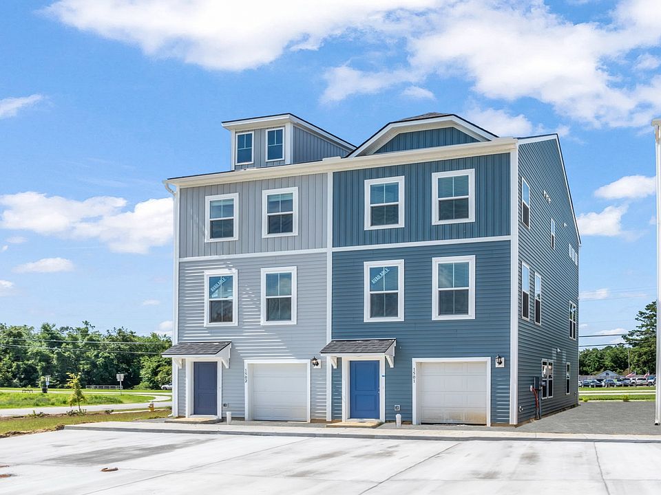 Hayden end unit townhome in Clear Springs with garage and extra windows for added natural light and