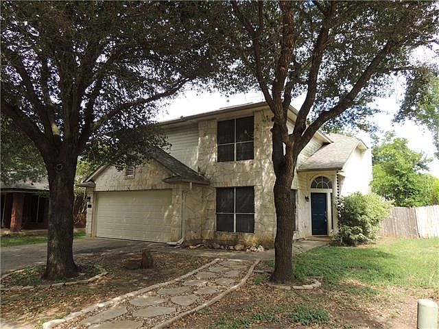 Tree shaded front lawn welcomes you home.