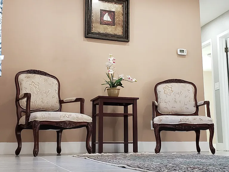 Living Room area with two Large Victorian Chairs.