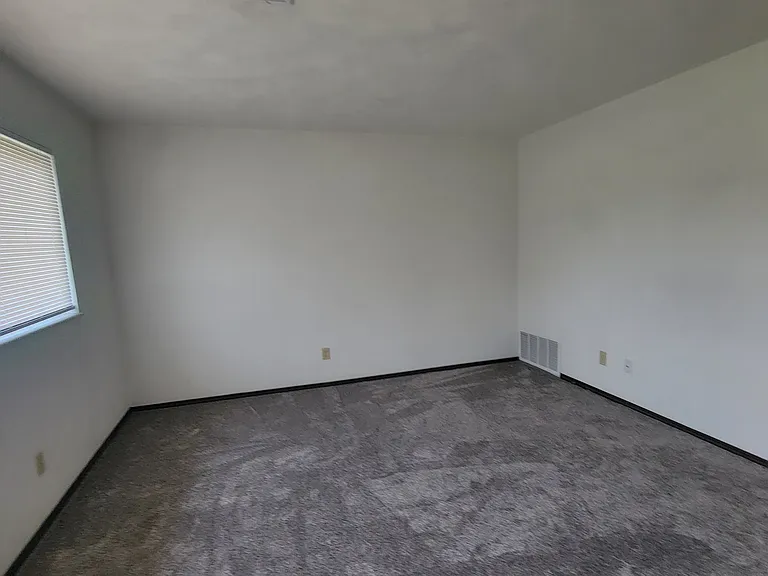 Newly painted & new carpet in the living room