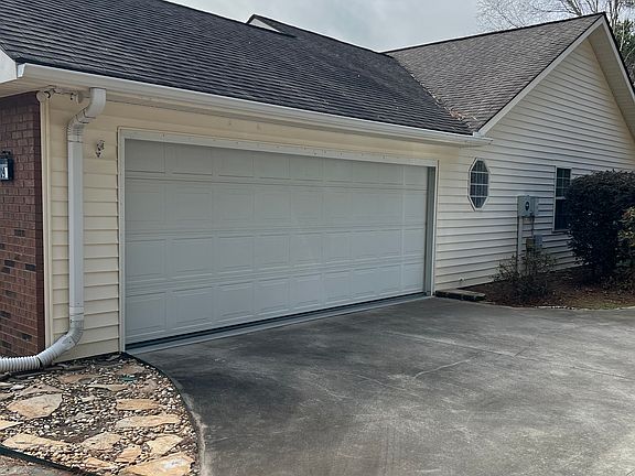 Two car attached garage with garage door.