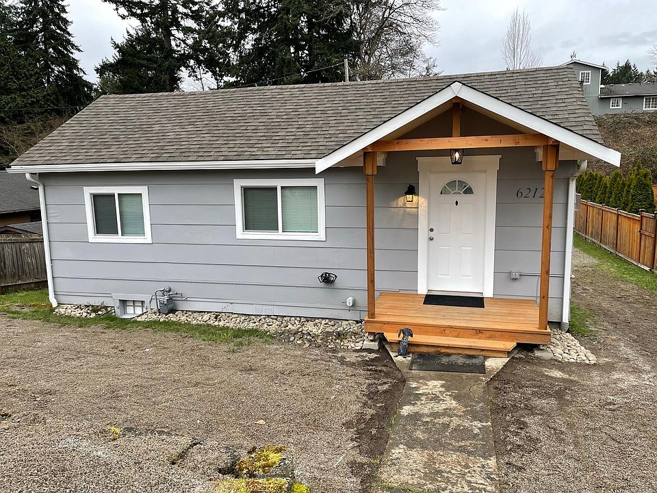 House Front. We recently spread dirt to level the yard and plant grass seed which hadn't sprouted yet.