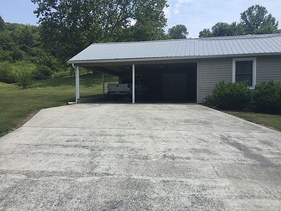 Attached carport w/ storage