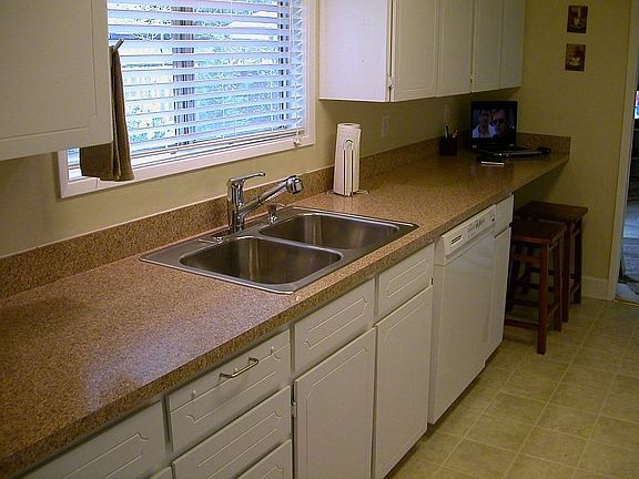 Newer Dishwasher, Counters, Sink, Faucet, Vinyl Floor, Refinished Cabinets