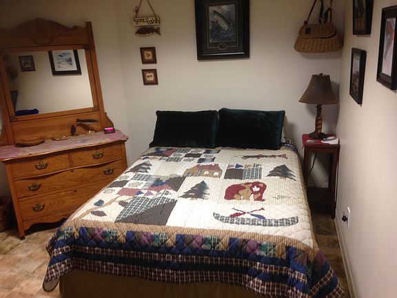Queen bed and dresser in bedroom