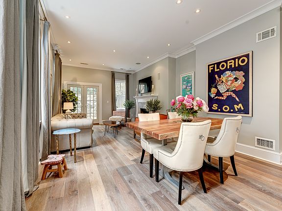 Stunning living room showcases dining area, high ceilings, recessed lighting, and French oak flooring