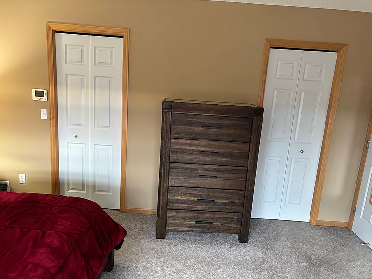 Primary bedroom with separate His and Hers closet