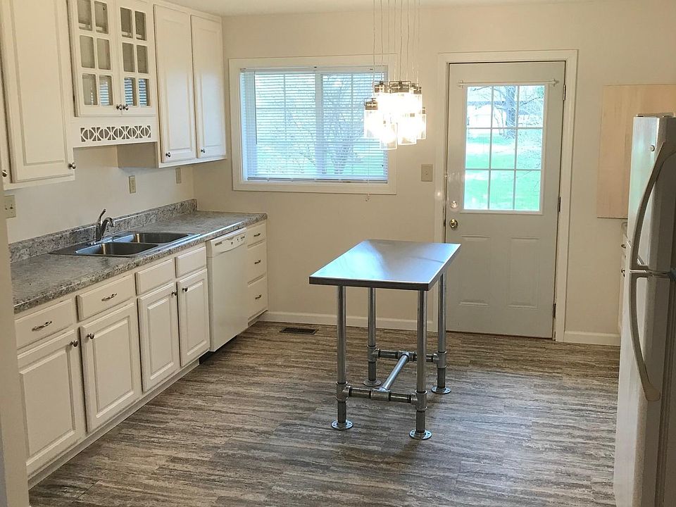 Newly remodeled kitchen and back door to small patio