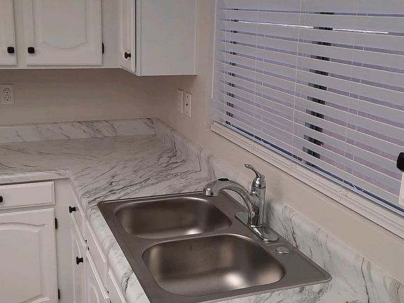 Beautiful countertops make food prep enjoyable. Amble counter space for all your needs.